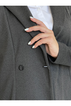 Жіноча жилетка з кашеміру. Жилетка з широким лацконом на три гудзика.