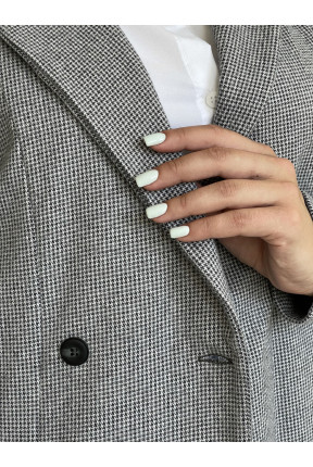 Жіноча жилетка з кашеміру. Жилетка з широким лацконом на три гудзика.